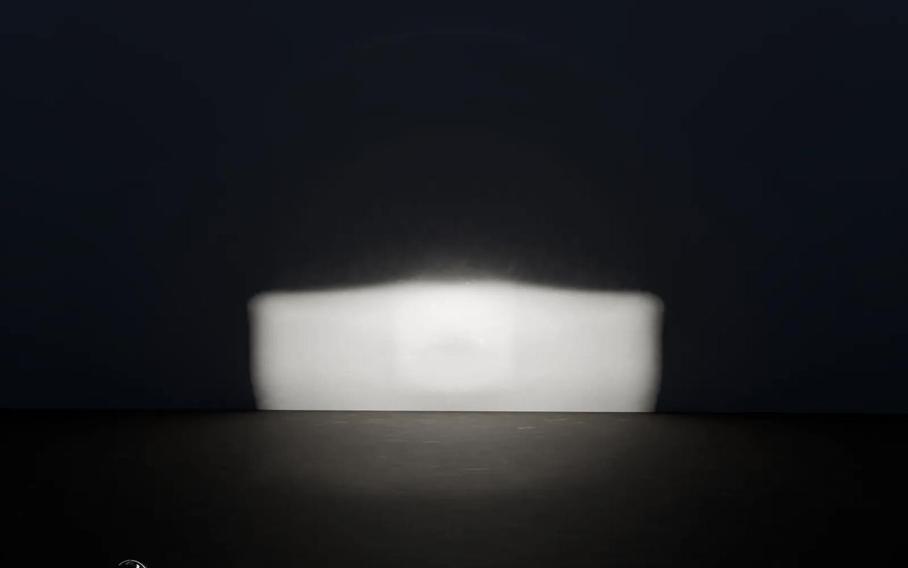 A wall lit by a headlamp computed by RayMapr: a bright, even area at the bottom, a sharp upper edge, darkness above.